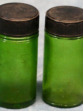 Vintage Green Glass Pill type bottles with inscriptions.  1 oz.